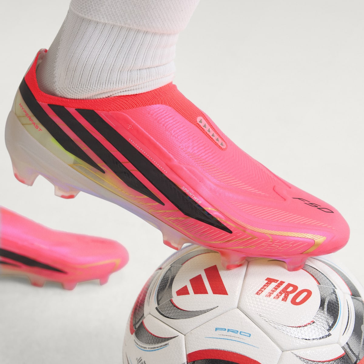 Adidas Women's F50 Hyperfast Elite Laceless Firm Ground Soccer Cleats - Solar Turbo / Core Black / Gold Metallic - Image 2